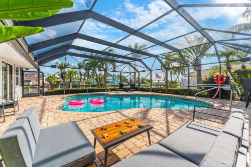 Casa De Olas - Waterfront Luxe Home - Heated Pool - Game Room - Boat Lift - Minutes to Beach